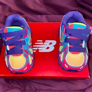 Multi-colored toddler’s New Balance sneakers